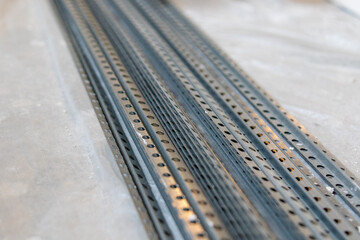 Plaster leveling guide profiles. Metal profiles with holes for smooth plastering of walls....
