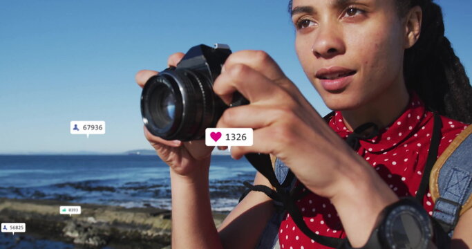 Taking photo, person surrounded by social media likes and follower count image