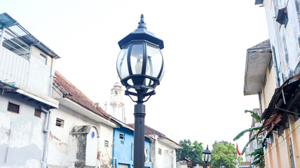 A close-up view of a decorative streetlamp with intricate design