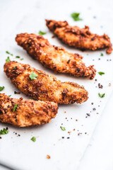 Crispy Chicken Tenders on White Surface