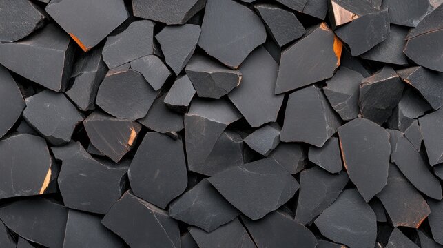 A close-up of dark, fragmented rock pieces with sharp edges.