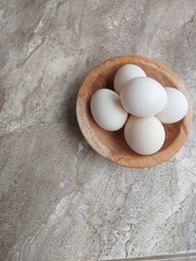 white Free range eggs. Chicken eggs on a floor background. Closeup photo. copy space