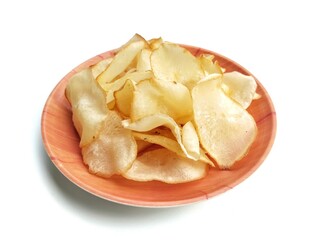 Keripik singkong or cassava chips on plate isolated on white background