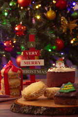 Desserts and cookies on a table with Christmas decorations