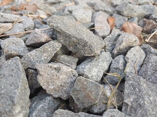Gravel road stone texture. Gray gravel pattern. Closeup road with small rocks