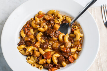 macaroni  mixed with beef stew