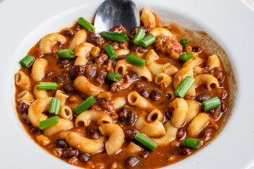 chilli macaroni  top with green onions