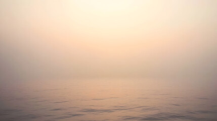 Serene seascape at dawn. Soft, hazy light bathes the calm water, creating a peaceful and tranquil atmosphere.  Minimalist and dreamy.