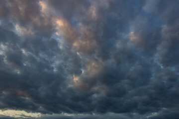 Obraz premium Dramatic sky with stormy clouds at sunset. Nature background