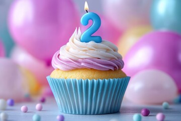 Colorful birthday cupcake with blue number 2 candle and festive pastel balloons for second birthday celebration card
