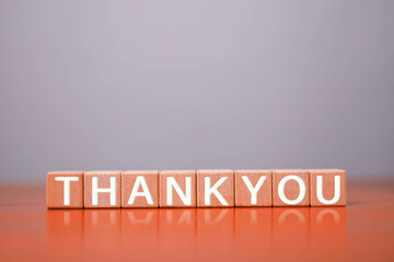 Thank you business for presentation, Wooden blocks arranged in rows display a message, The message...