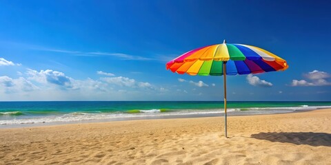 Colorful beach umbrella providing shade on a sandy shore, beach, summer, umbrella, shade, relaxation, vacation, coastal
