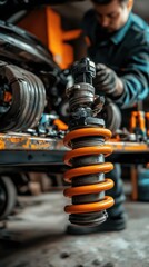 A mechanic working on a car's suspension system with a focus on a coil spring.
