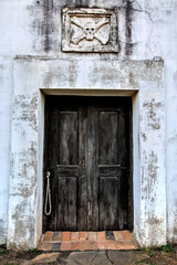 The skull and cross bones over the doorway, are a reminder of one's own mortality.