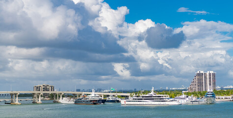 Miami port with ship and yacht boat. Marina landscape. Summer travel and vacation. Boat trip. Luxury yacht docked in port of Miami. Miami south beach, Florida. Waterfront view of port in Florida