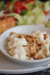 Delicious Bowl of Fresh Cottage Cheese With Crunchy Walnuts and Fresh Salad