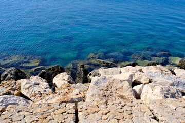 blue sea water and shore rocks