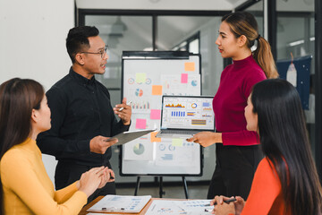 Team discussing data analysis with charts and graphs