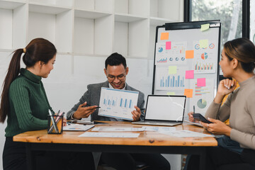 Business team discussing charts in meeting room