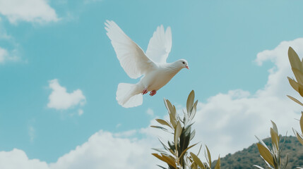 Obraz premium Serene landscape with white dove in flight symbolizing peace and ceasefire, calm blue sky, distant mountains, and single olive branch in foreground.