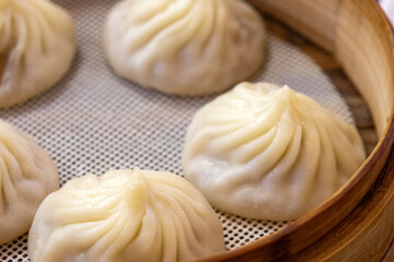Steamed Xiao Long Bao in the bamboo basket.