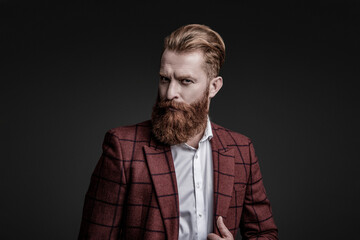 Bearded man in tailored formal menswear. Man businessman in bespoke formalwear. Business man in elegant tailored suit. Formal tailored suit. Vintage style. Gentleman menswear. Bespoke suit