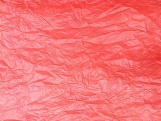Fototapeta premium Red crumpled plastic bag texture and background 