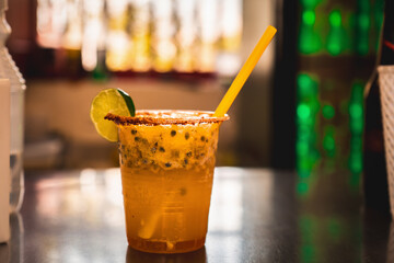 Refreshing Colombian michelada with passion fruit, lime, and chili rim