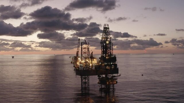 Aerial view of an offshore jack up drilling rig during sunset - oil and gas upstream industry
