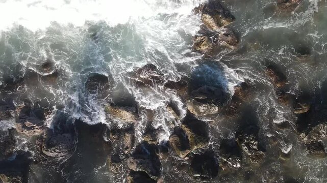 Cinematic drone overlook of Sharks Cove's Waves Pupukea Laniakea Beach North Shore Oahu Hawaii