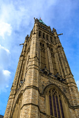 Fototapeta premium A tall, brown building with a green dome on top