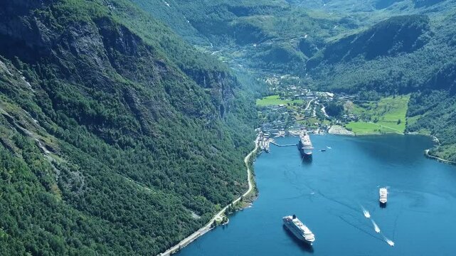 Fjord township with massive cruise ships in Norway, aerial view