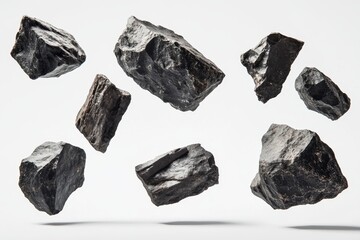 A group of dark rugged rocks floating in mid-air against a white background