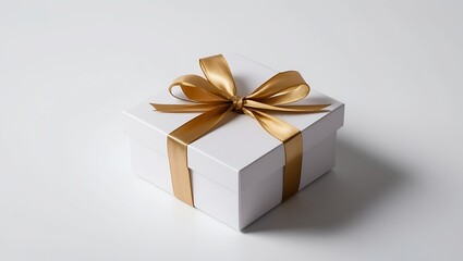 Obraz premium white gift box with gold ribbon isolated on white background