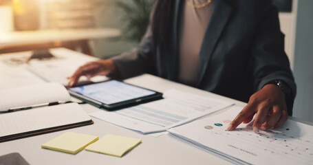 Person hands, tablet and paper in office for business, financial planning and data analysis at night. Woman, tech or documents with graphs for growth projection, company development or audit deadline