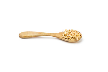 Oat groats on wooden spoon isolated on white background. Oats contain nutrients that help prevent many diseases, boost immunity, regulate blood sugar levels, and lower cholesterol.