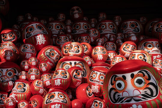 A Daruma doll is a hollow, round, Japanese traditional doll modelled after Bodhidharma, the founder of the Zen tradition of Buddhism. 