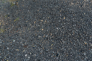 Pile of grey crushed stone. Abstract background and texture for design.