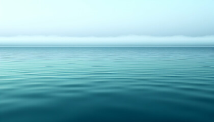 Obraz premium Serene ocean scene with calm water and misty horizon.