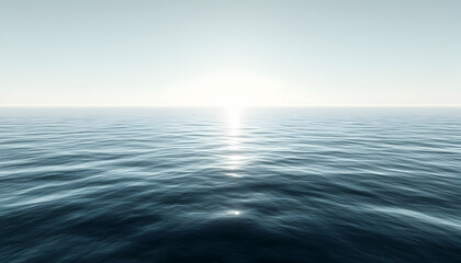 Obraz premium Calm ocean surface with sun reflecting on water.