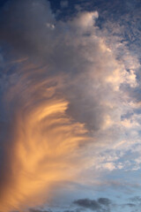 Dramatic sky with swirling clouds at sunset abstract textured background