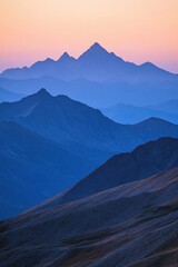 Serene mountain landscape at dusk with layered peaks and soft colors.