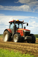 Tractor working in a large agricultural field