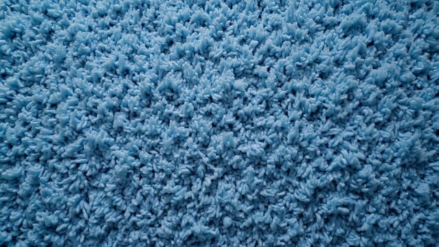 Abstract Shaggy Blue Carpet Texture, Soft Fluffy Pile Fabric Background - Top View Close-Up