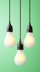 Three white light bulbs hanging from a green background