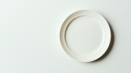 A Single White Oval Plate on White Background