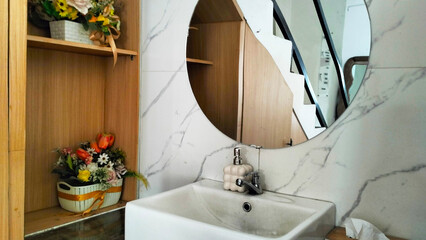 storage shelves and minimalist mirror with marble sink