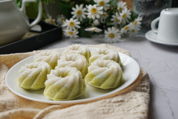 Kuih Puteri Ayu, a popular traditional Malaysian steamed sponge pandan coconut cake.