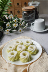 Kuih Puteri Ayu, a popular traditional Malaysian steamed sponge pandan coconut cake.