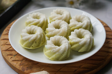 Kuih Puteri Ayu, a popular traditional Malaysian steamed sponge pandan coconut cake.